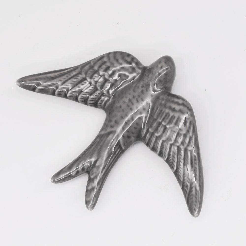Hirondelle en céramique grise