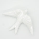 Hirondelle traditionnelle en céramique blanche