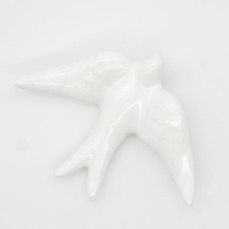 Hirondelle traditionnelle en céramique blanche
