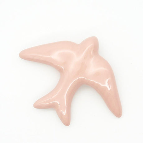 Hirondelle traditionnelle en céramique rose